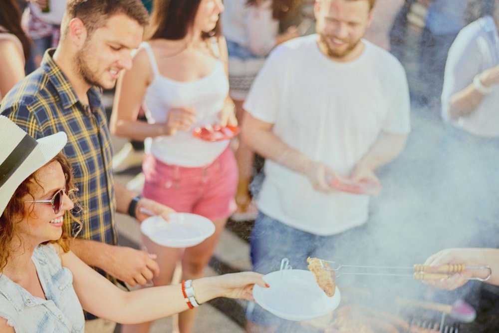 group standing around grill