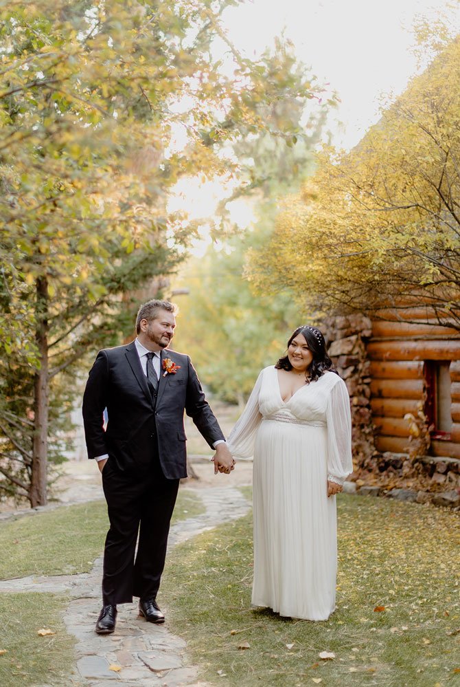 Bride and Groom holding bouquet of flowers