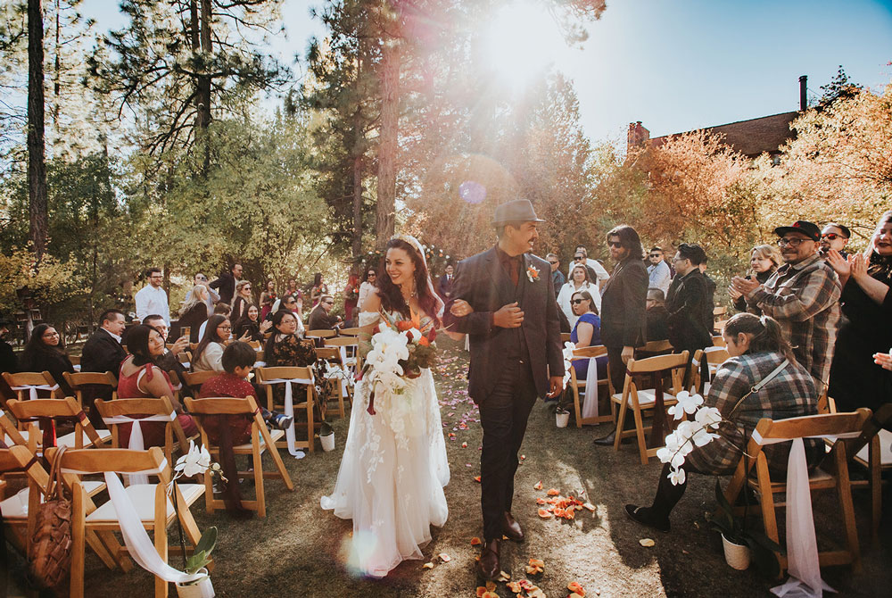 Bride and groom wlkind down the isle post ceremony