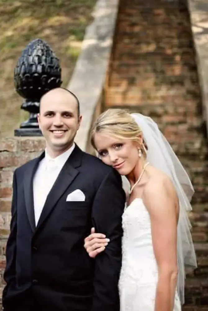 wedding couple posing for camera