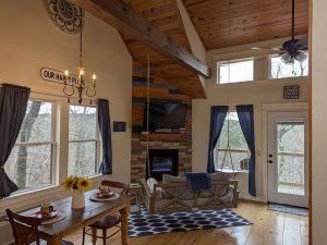 Fireplace next to the dining table and couch swing