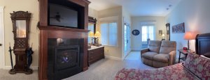 King-sized bed between two lamps in bedroom