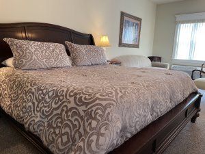 King-sized bed between two lamps