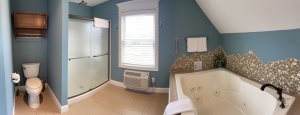 Reclining chair and vanity in corner of the room