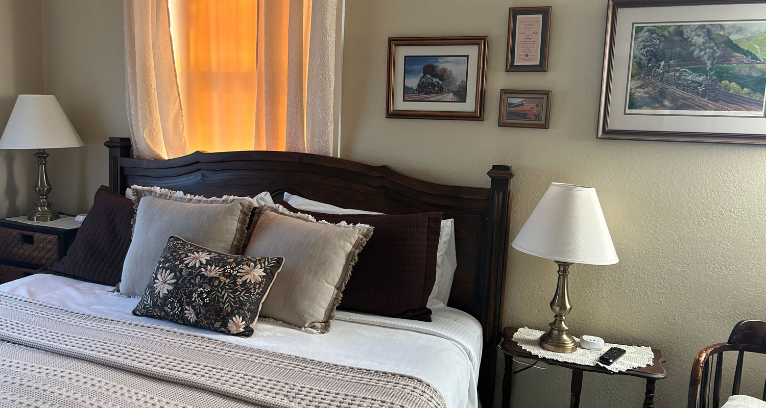 Bed with end tables and lamps