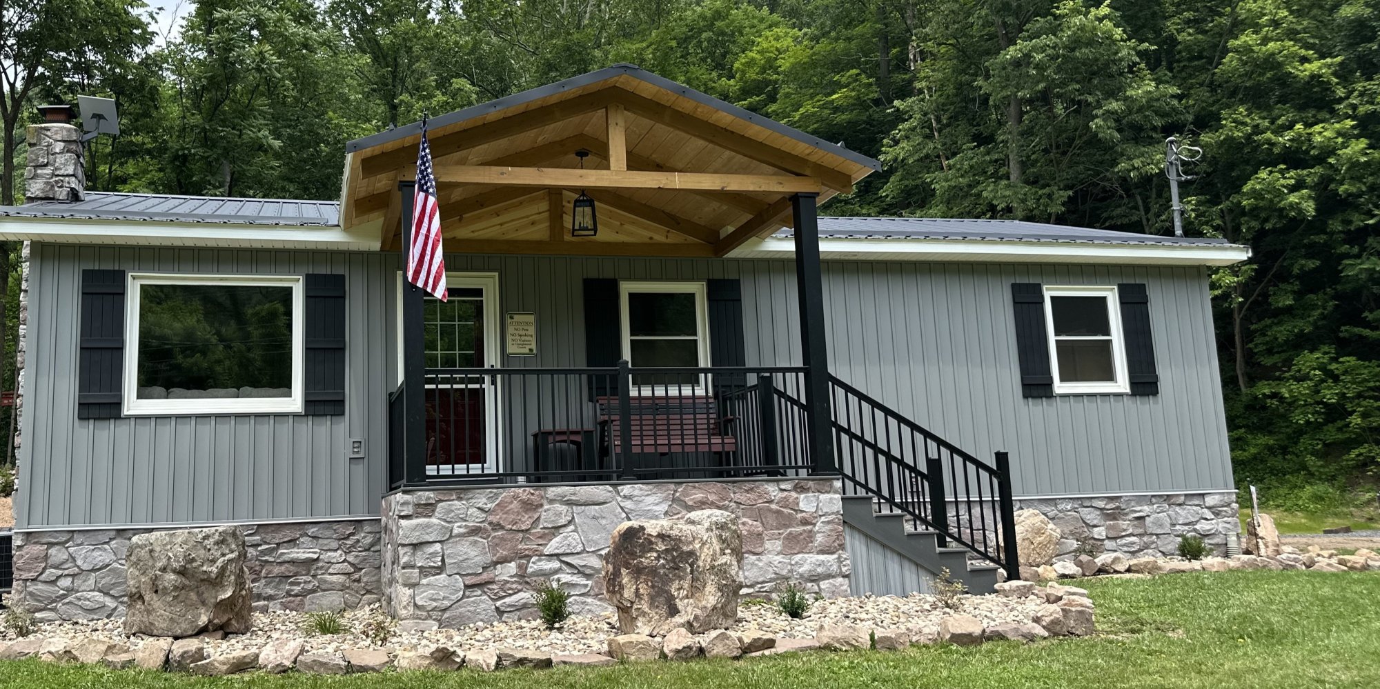 Small cottage with shutters and covered porch