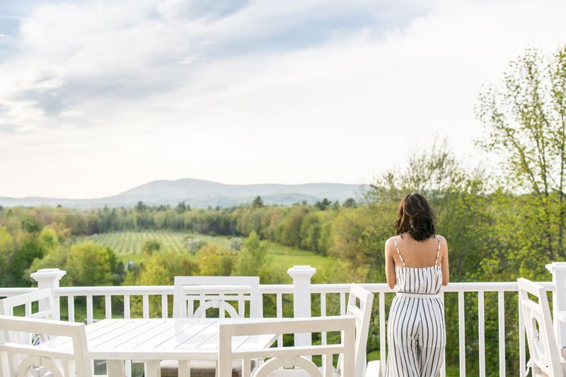 Woman on a deck taking in the view