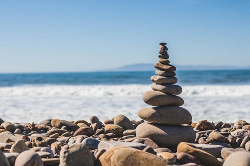 Stack of rocks by coastline