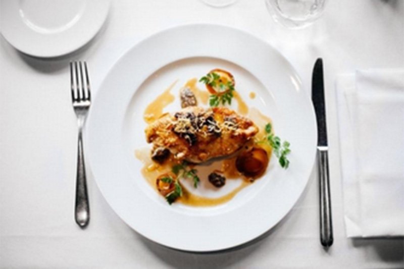 Gourmet dish set at table