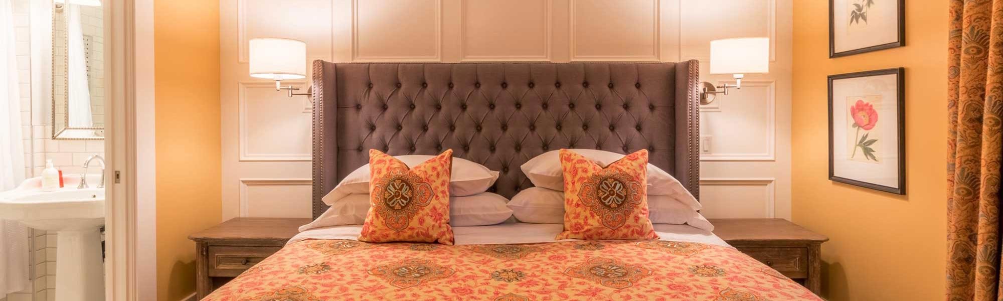 Orange Bed with Decorative Pillows