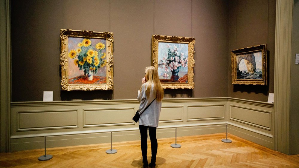 Girl admiring a painting