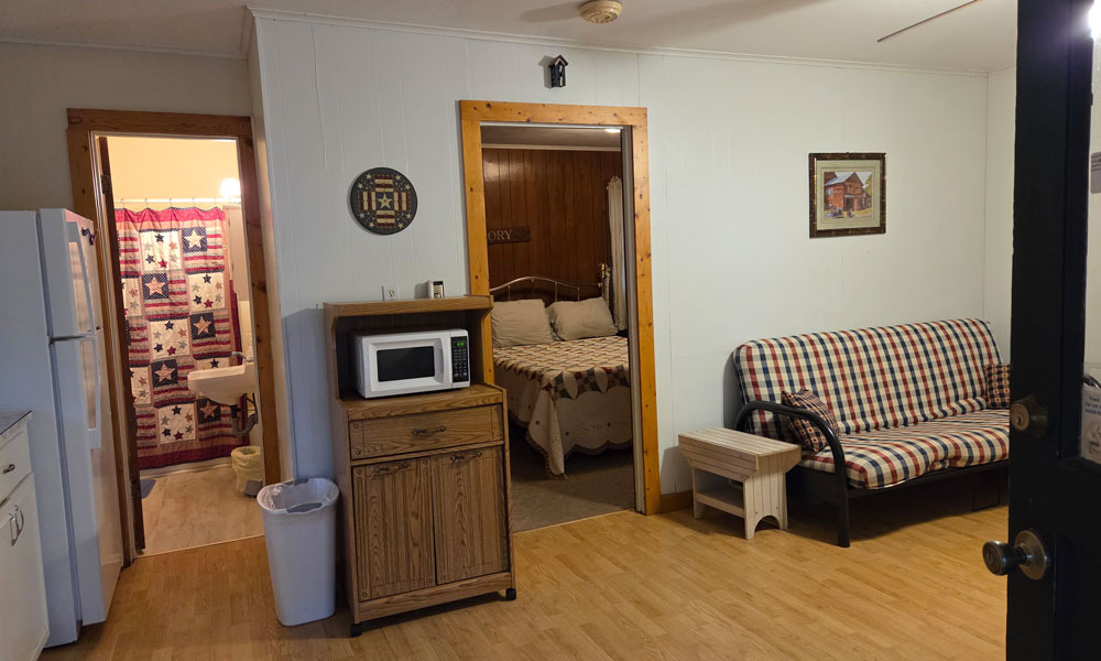View of bedroom through the kitchen