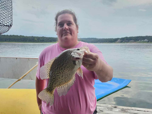 Woman on a dock with fish