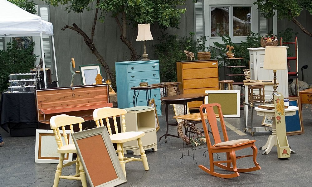 chairs and other furniture outside antique shop